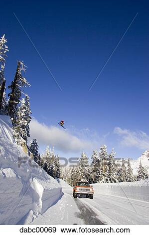 Downhill ski jumper in air View Large Photo Image Stock Photo - Downhill ski jumper in air. Fotosearch