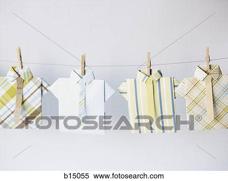 Stock Photography - Dress shirts on clothesline with clothes pegs. Fotosearch