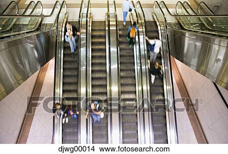 Escalators with people and motion blur View Large Photo Image Picture - Escalators with people and motion blur. Fotosearch