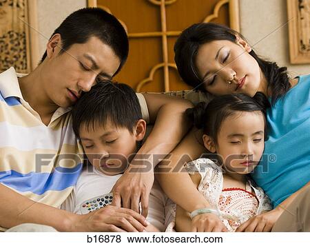 Stock Photo - Family asleep on couch. Fotosearch