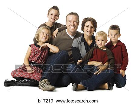 Family of six sitting cross legged posing and smiling View Large Photo Image Stock Photo - Family of six sitting cross legged posing and smiling. Fotosearch