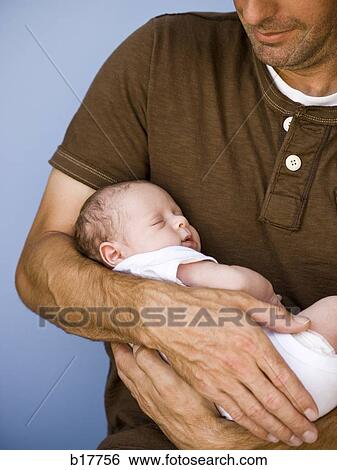 Father holding newborn baby. View Large Photo Image Stock Photograph - Father holding newborn baby.. Fotosearch