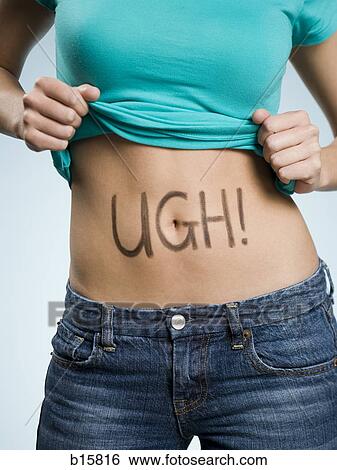 Stock Photograph - Female Abdomen with UGH! written on it. Fotosearch