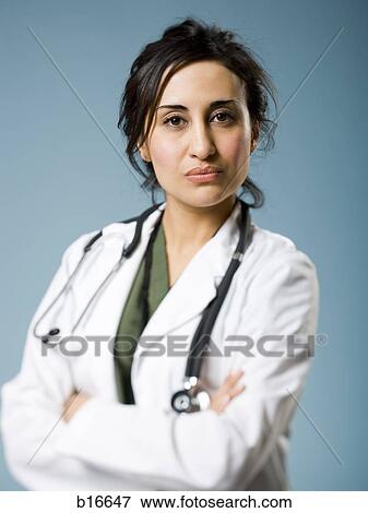 Female doctor with arms crossed View Large Photo Image Stock Photo - Female doctor with arms crossed. Fotosearch