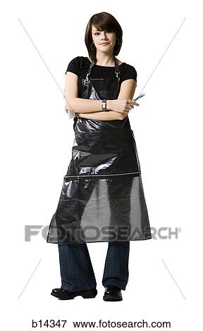 Stock Photo - Female hairdresser holding scissors. Fotosearch