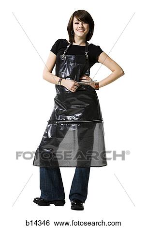 Female hairdresser standing with comb smiling View Large Photo Image Stock Photograph - Female hairdresser standing with comb smiling. Fotosearch