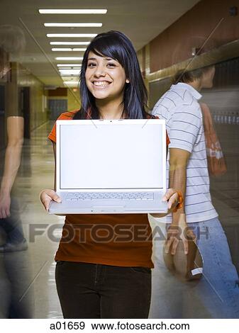 Female High School student holds notebook computer. View Large Photo Image Stock Photo - Female High School student holds notebook computer.. Fotosearch