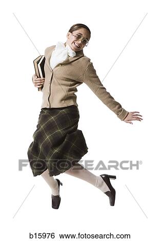Female librarian with eyeglasses and books jumping and smiling View Large Photo Image Stock Photograph - Female librarian with eyeglasses and books jumping and smiling. Fotosearch