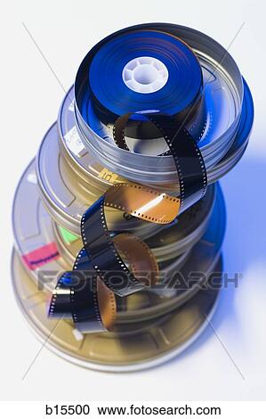 Film strip in pile of canisters View Large Photo Image Stock Image - Film strip in pile of canisters. Fotosearch