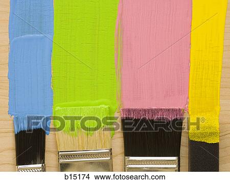 Picture - Four paint brushes with stripes of paint. Fotosearch