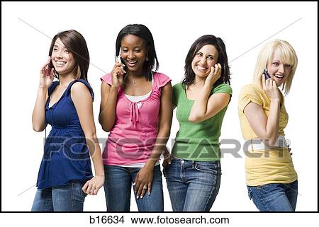 Four women talking on cell phones smiling View Large Photo Image Picture - Four women talking on cell phones smiling. Fotosearch