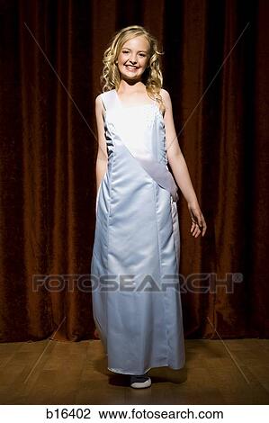 Girl beauty pageant contestant smiling on stage View Large Photo Image Stock Image - Girl beauty pageant contestant smiling on stage. Fotosearch