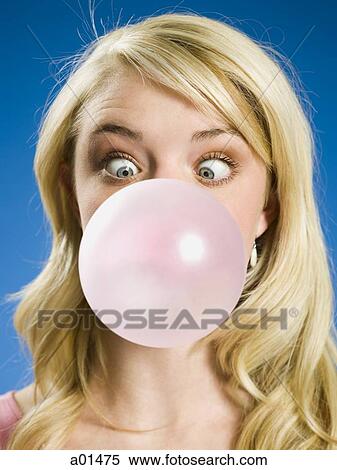 Girl blowing bubble and cross eyed View Large Photo Image Stock Photography - Girl blowing bubble and cross eyed. Fotosearch