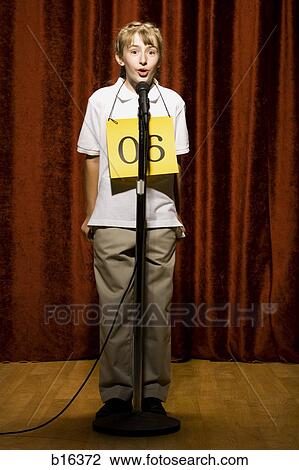 Girl contestant standing at microphone speaking View Large Photo Image Stock Image - Girl contestant standing at microphone speaking. Fotosearch