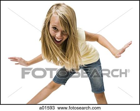 Girl dancing with arms up smiling View Large Photo Image Stock Image - Girl dancing with arms up smiling. Fotosearch