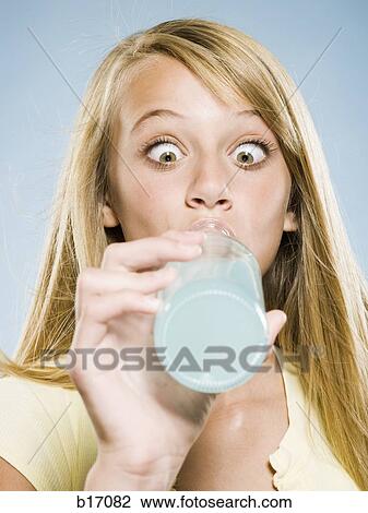 Girl drinking soda from bottle with eyes crossed View Large Photo Image Stock Image - Girl drinking soda from bottle with eyes crossed. Fotosearch