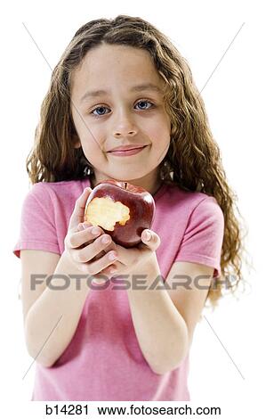Girl eating apple View Large Photo Image Stock Image - Girl eating apple. Fotosearch