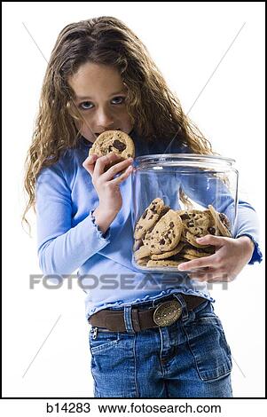 Girl eating cookies View Large Photo Image Stock Image - Girl eating cookies. Fotosearch