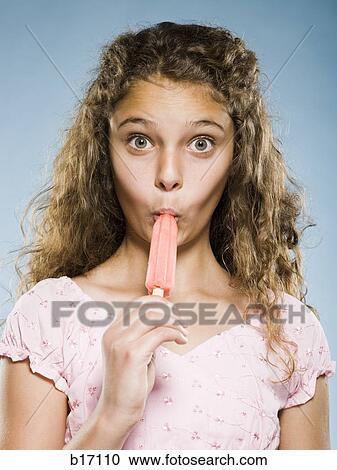 Girl eating Popsicle View Large Photo Image Stock Image - Girl eating Popsicle. Fotosearch