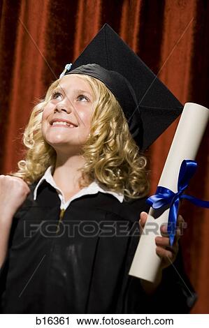 Girl graduate with mortar board and diploma smiling View Large Photo Image Stock Image - Girl graduate with mortar board and diploma smiling. Fotosearch