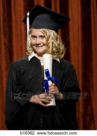 Stock Image - Girl graduate with mortar board and diploma smiling. Fotosearch
