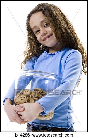 Girl holding cookie jar. View Large Photo Image Stock Photograph - Girl holding cookie jar.. Fotosearch