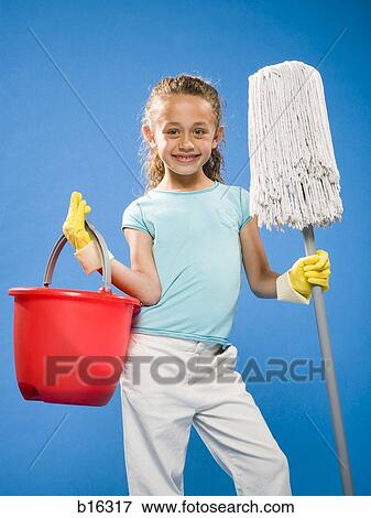Girl holding mop and bucket with rubber gloves smiling View Large Photo Image Stock Photo - Girl holding mop and bucket with rubber gloves smiling. Fotosearch