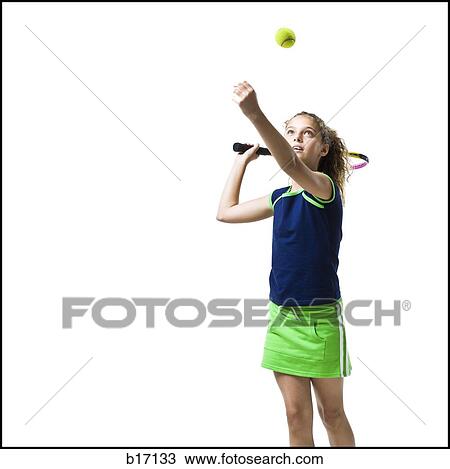 Girl holding tennis racquet and serving View Large Photo Image Stock Image - Girl holding tennis racquet and serving. Fotosearch