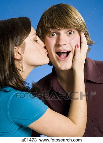 Girl kissing boy on cheek View Large Photo Image Stock Image - Girl kissing boy on cheek. Fotosearch