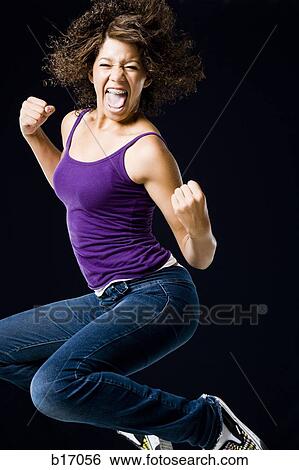 Girl leaping and smiling View Large Photo Image Stock Photograph - Girl leaping and smiling. Fotosearch