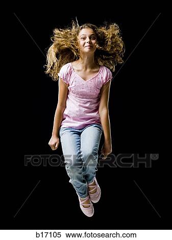 Girl leaping and smiling View Large Photo Image Stock Photography - Girl leaping and smiling. Fotosearch