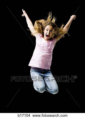 Girl leaping and smiling with arms up View Large Photo Image Picture - Girl leaping and smiling with arms up. Fotosearch