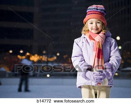 Girl outdoors in winter smiling View Large Photo Image Stock Image - Girl outdoors in winter smiling. Fotosearch