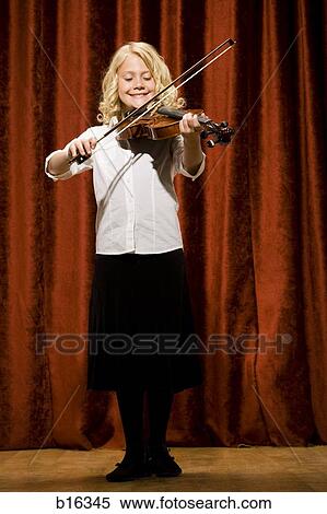 Girl playing violin on stage View Large Photo Image Stock Photography - Girl playing violin on stage. Fotosearch