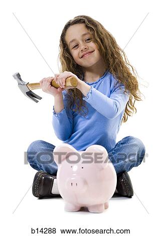 Girl sitting cross legged with hammer and piggy bank smiling View Large Photo Image Stock Photo - Girl sitting cross legged with hammer and piggy bank smiling. Fotosearch