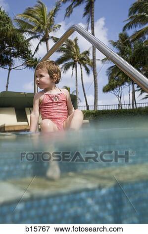 Girl sitting in outdoor pool View Large Photo Image Stock Photo - Girl sitting in outdoor pool. Fotosearch