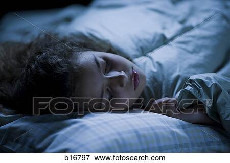 Girl sleeping in bed View Large Photo Image Stock Photo - Girl sleeping in bed. Fotosearch