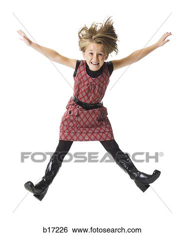 Girl smiling and leaping View Large Photo Image Stock Photograph - Girl smiling and leaping. Fotosearch