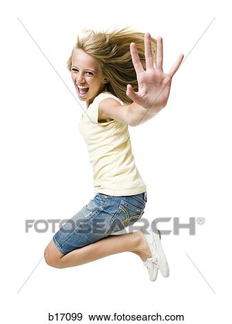 Stock Photo - Girl smiling and leaping with hand up. Fotosearch