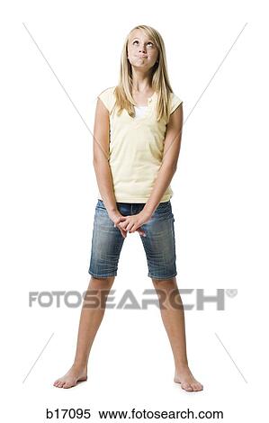 Girl standing and looking up with eyes crossed View Large Photo Image Stock Photography - Girl standing and looking up with eyes crossed. Fotosearch