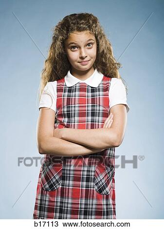 Girl standing with arms crossed smiling View Large Photo Image Stock Image - Girl standing with arms crossed smiling. Fotosearch