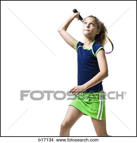 Girl swinging tennis racquet View Large Photo Image Picture - Girl swinging tennis racquet. Fotosearch