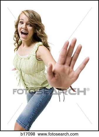 Girl with braces dancing and smiling with arms up View Large Photo Image Stock Photo - Girl with braces dancing and smiling with arms up. Fotosearch