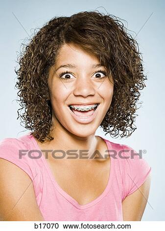 Girl with braces smiling View Large Photo Image Stock Image - Girl with braces smiling. Fotosearch