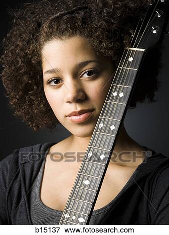 Girl with guitar View Large Photo Image Stock Photo - Girl with guitar. Fotosearch