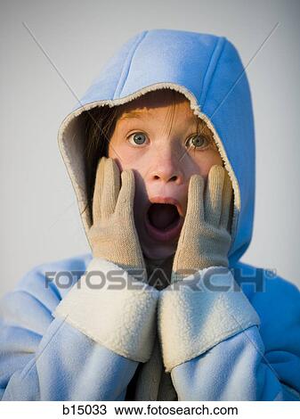 Girl with hands on face and mouth open with winter coat and hood View Large Photo Image Stock Image - Girl with hands on face and mouth open with winter coat and hood. Fotosearch