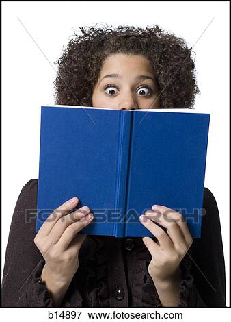 Girl with hardcover book View Large Photo Image Stock Photo - Girl with hardcover book. Fotosearch