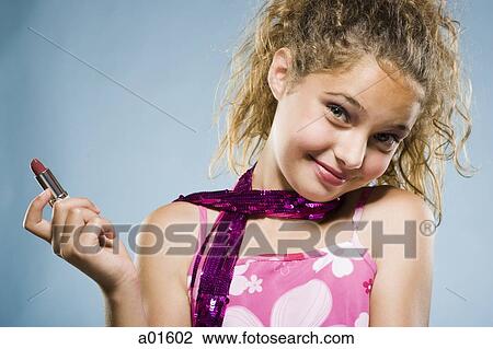 Stock Image - Girl with lipstick smiling. Fotosearch