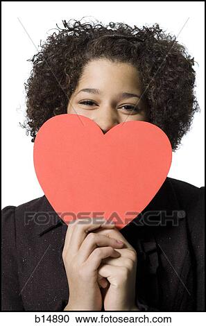 Girl with red heart View Large Photo Image Stock Image - Girl with red heart. Fotosearch