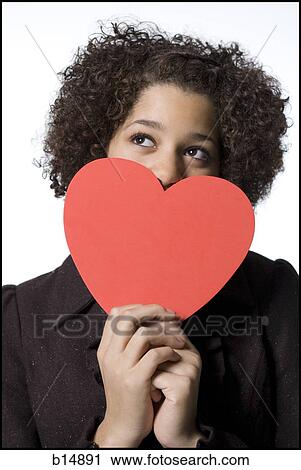 Girl with red heart View Large Photo Image Stock Image - Girl with red heart. Fotosearch